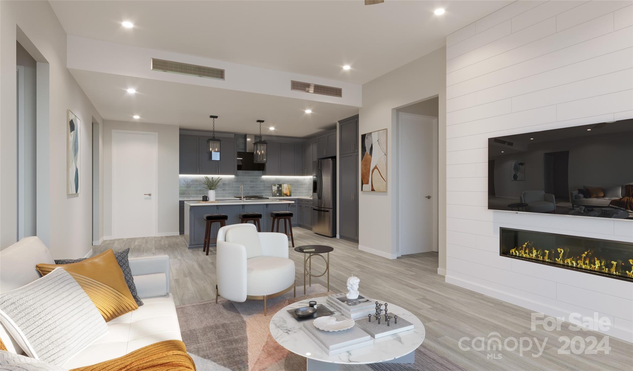 a living room with furniture and a flat screen tv