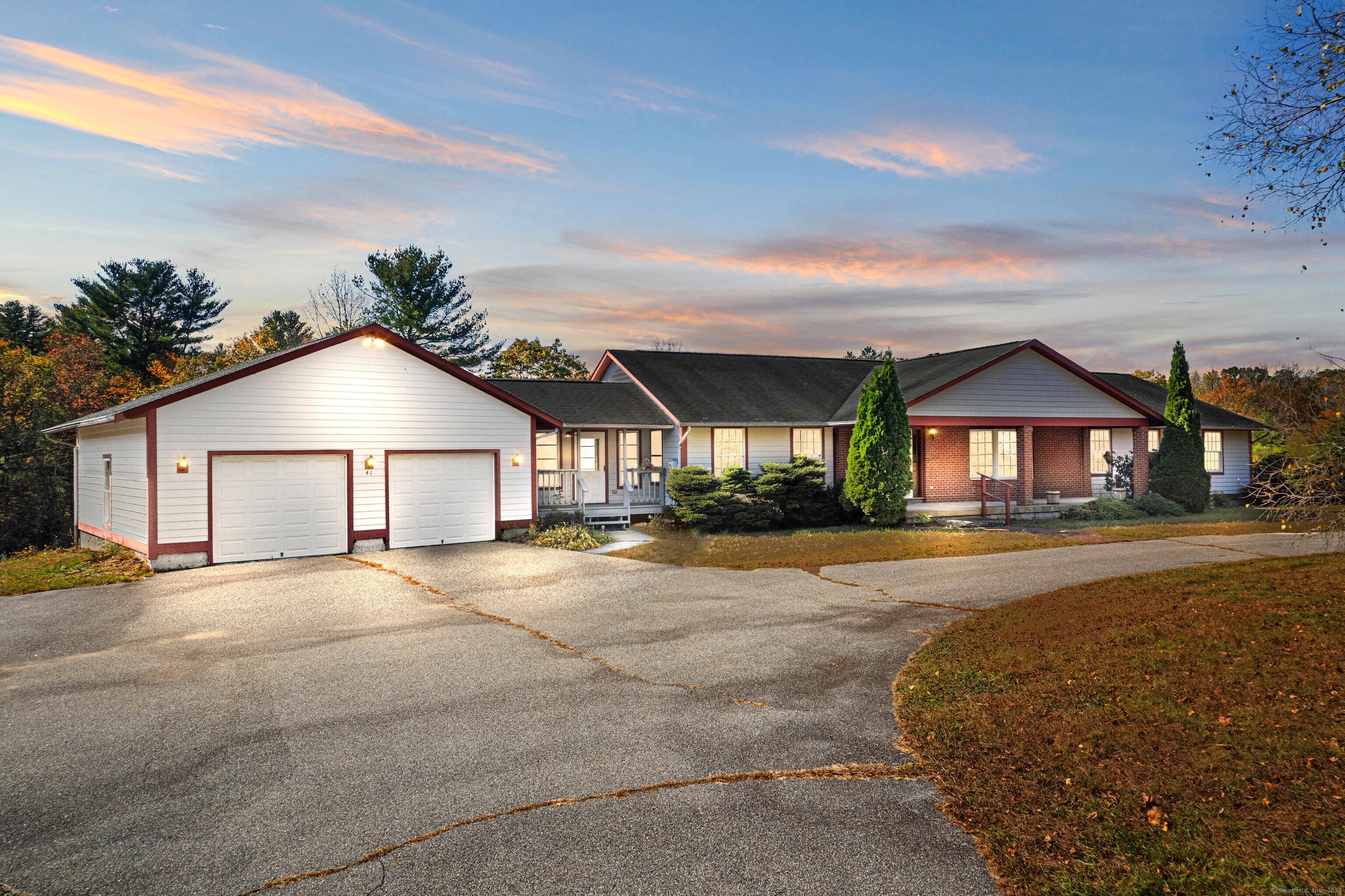 a view of a house with a yard and garage