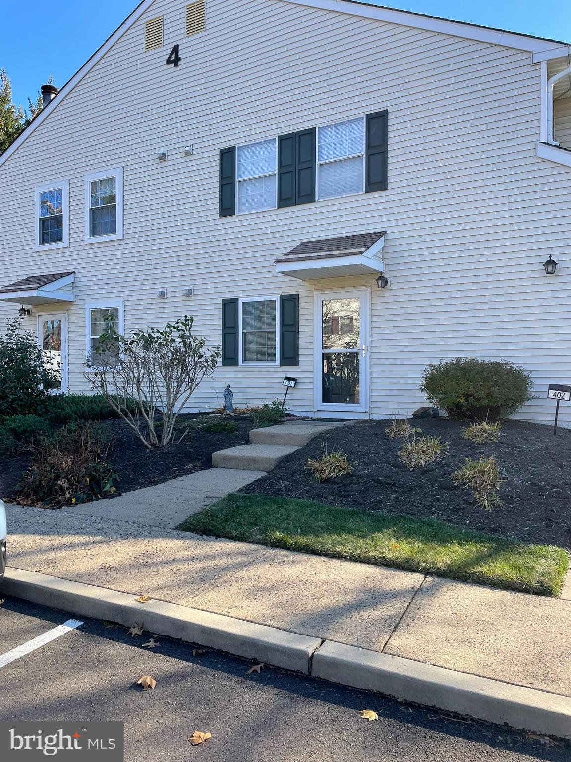 a front view of a house with yard