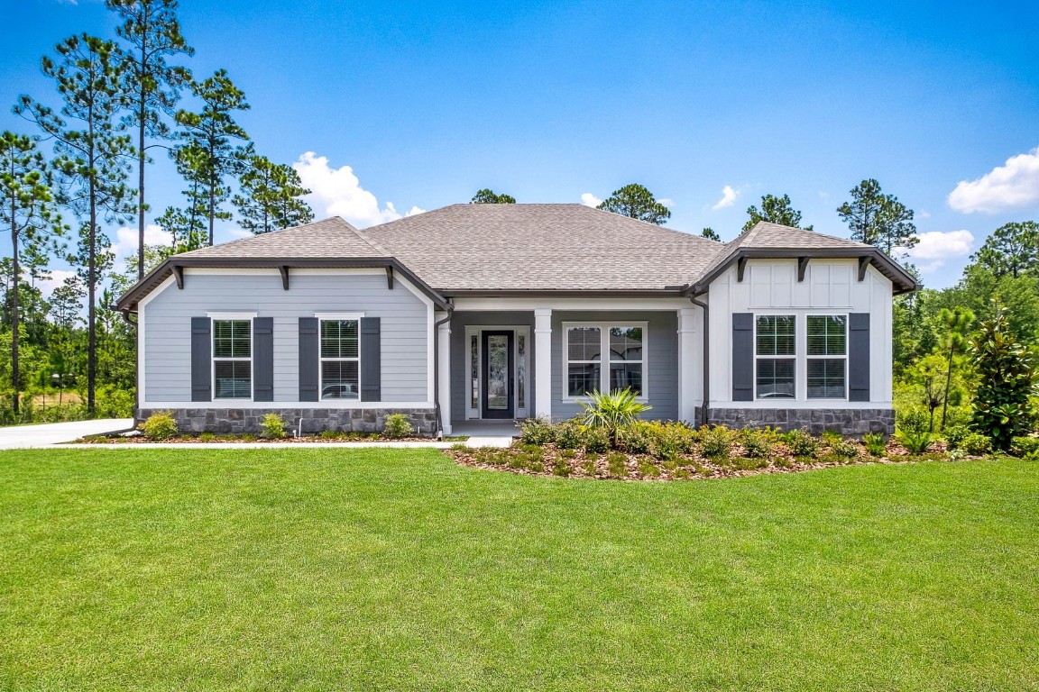 front view of a house with a yard