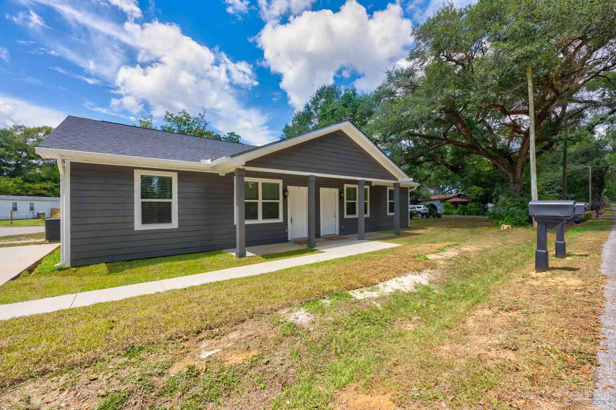 a front view of a house with a yard