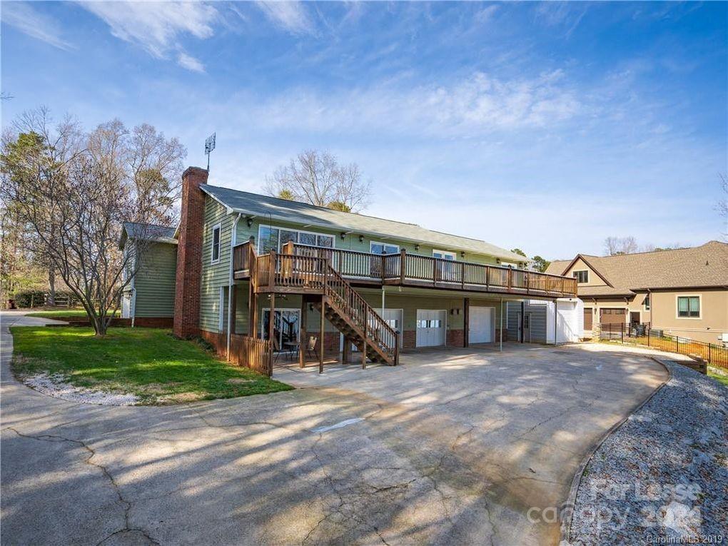 a view of a house next to a yard