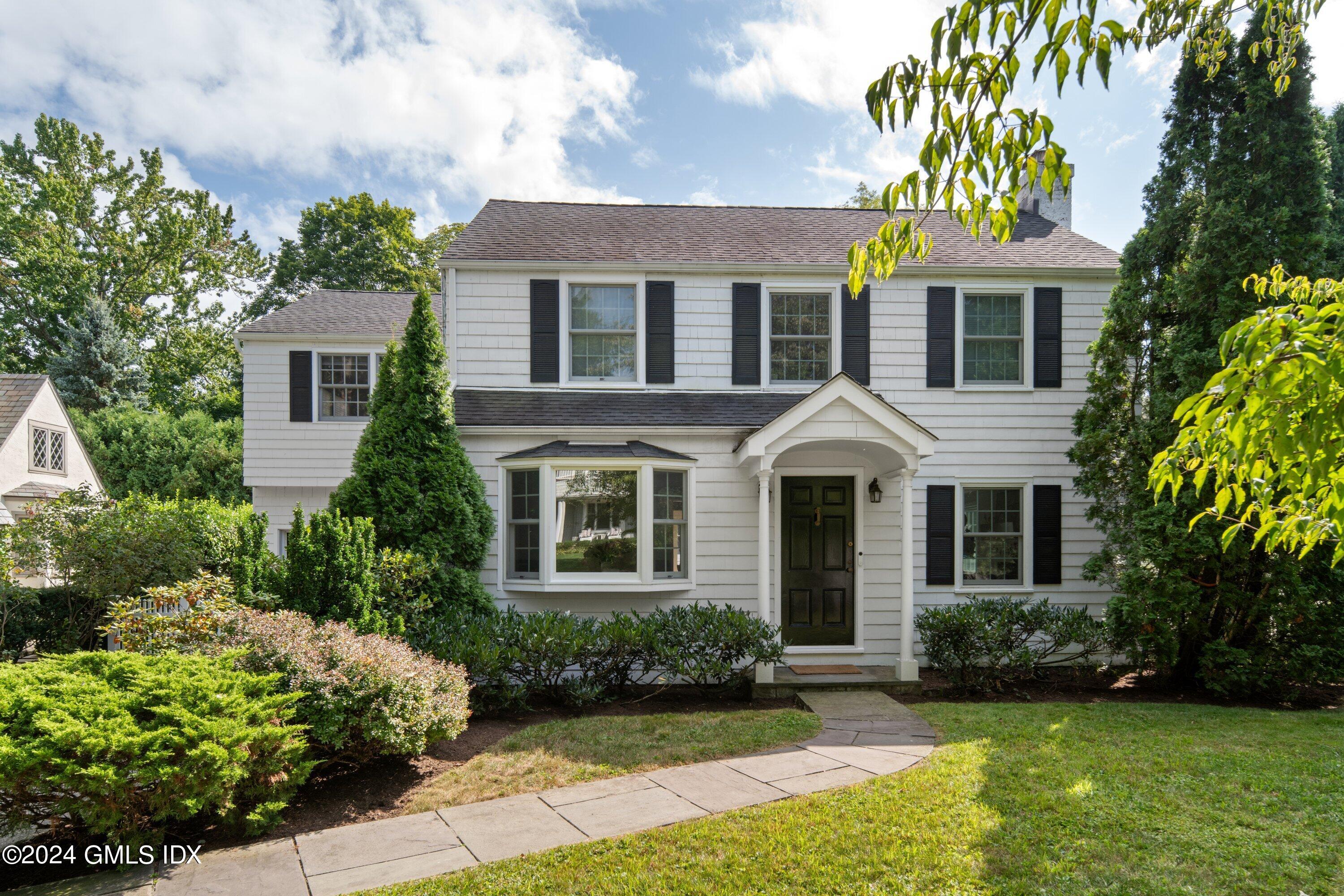 front view of a house with a yard