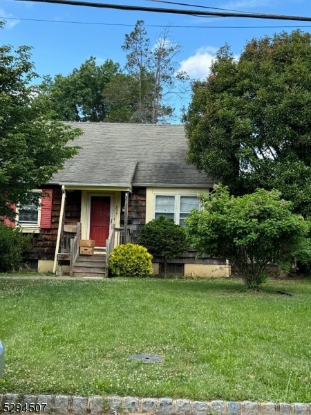 a view of a house with a yard porch and sitting area