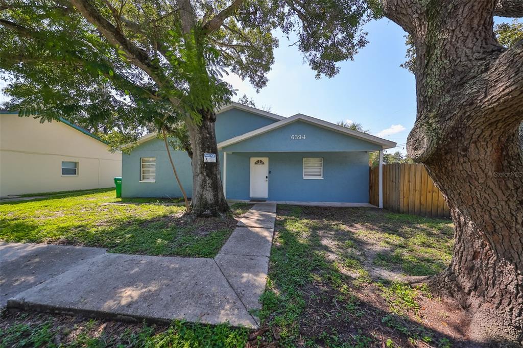 a view of a house with a yard