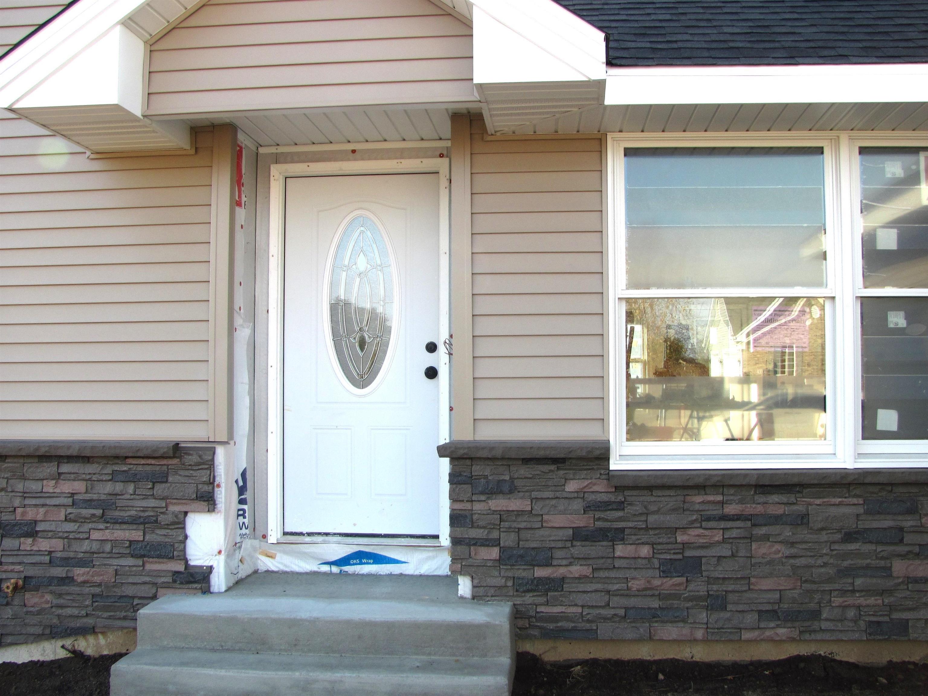 a front view of a house with a door