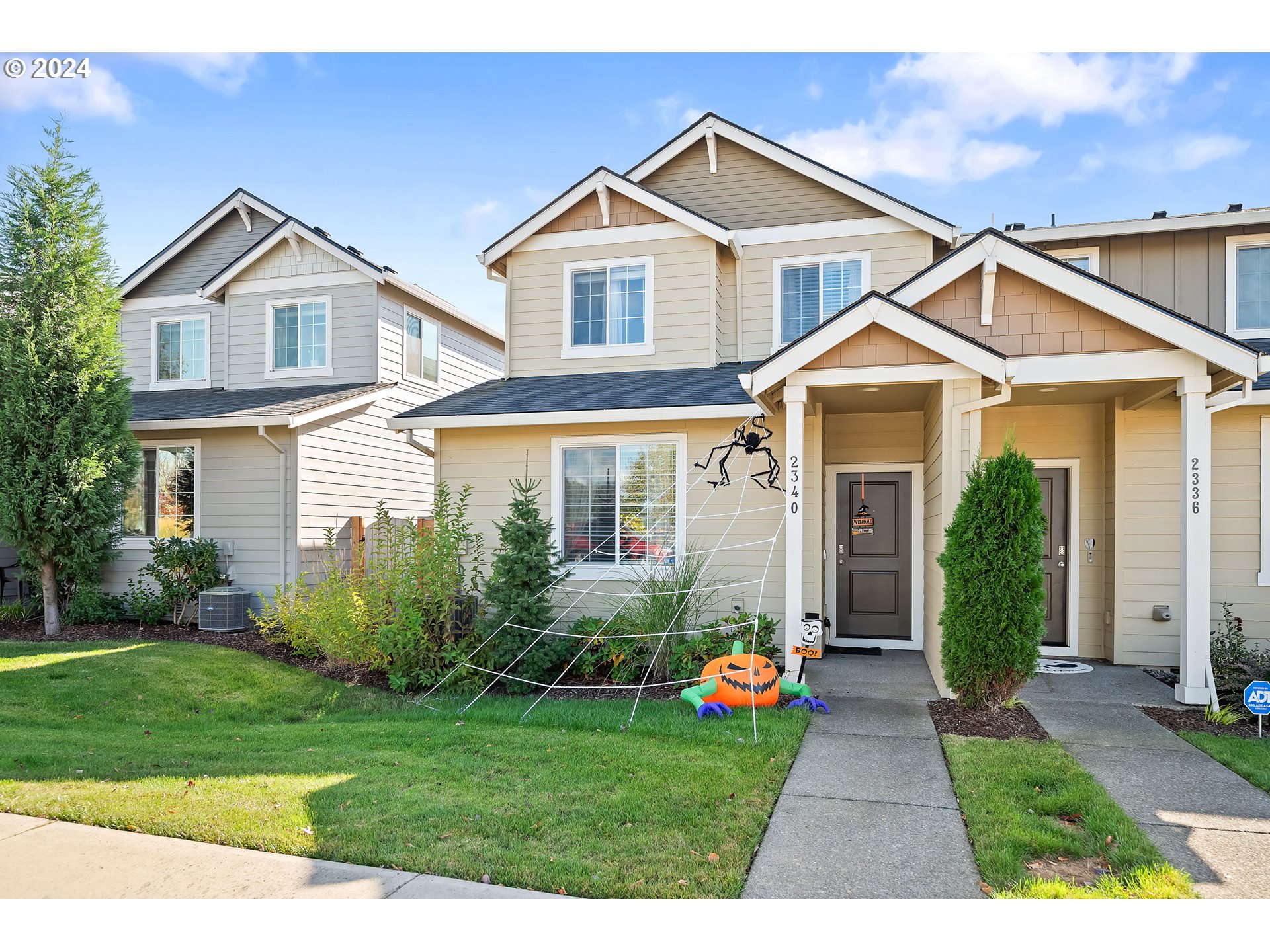 a front view of a house with garden