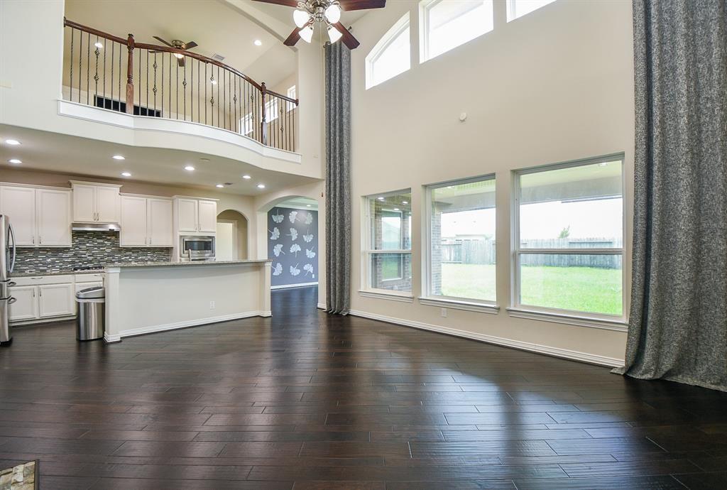 a view of an entryway and kitchen with a window