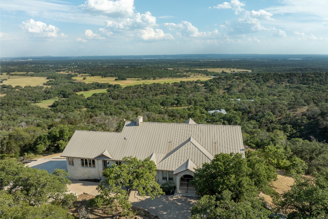 an aerial view of houses with yard