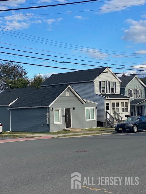 a view of a street in front of a house