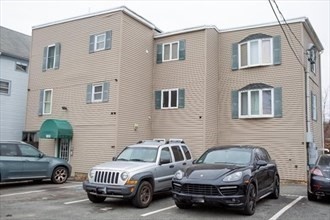 a view of a car parked in front of a house