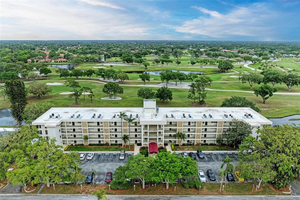 an aerial view of building with trees