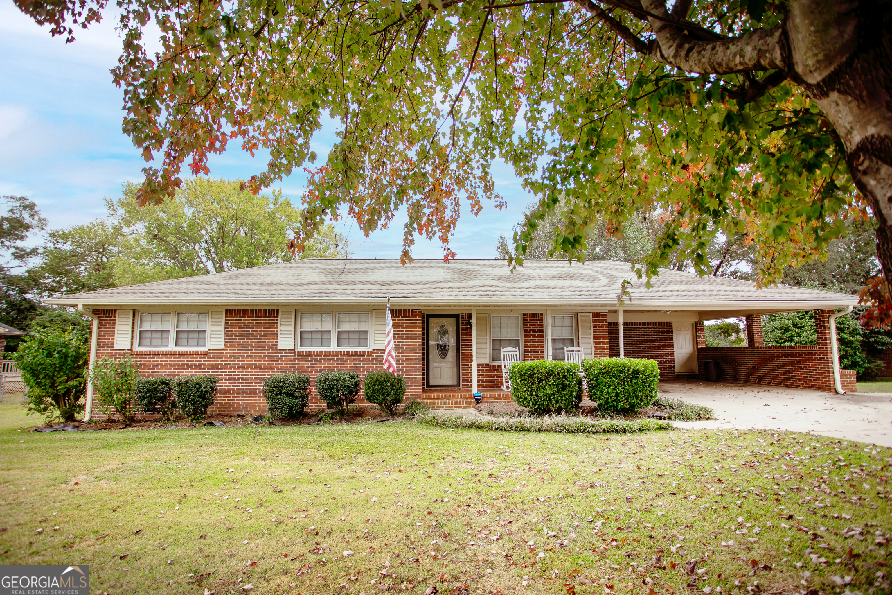 front view of a house with a yard