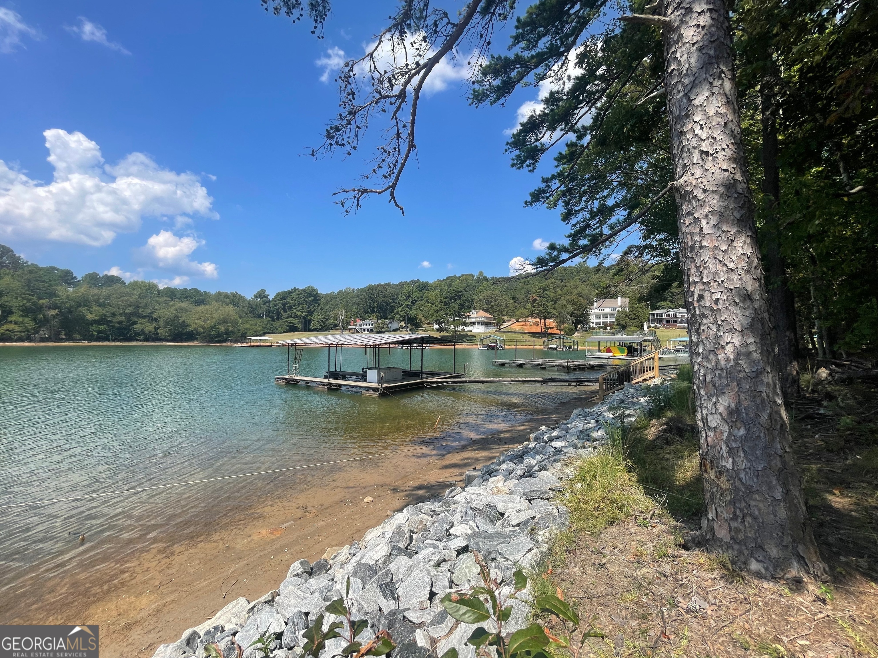 a view of a lake with a house in the background