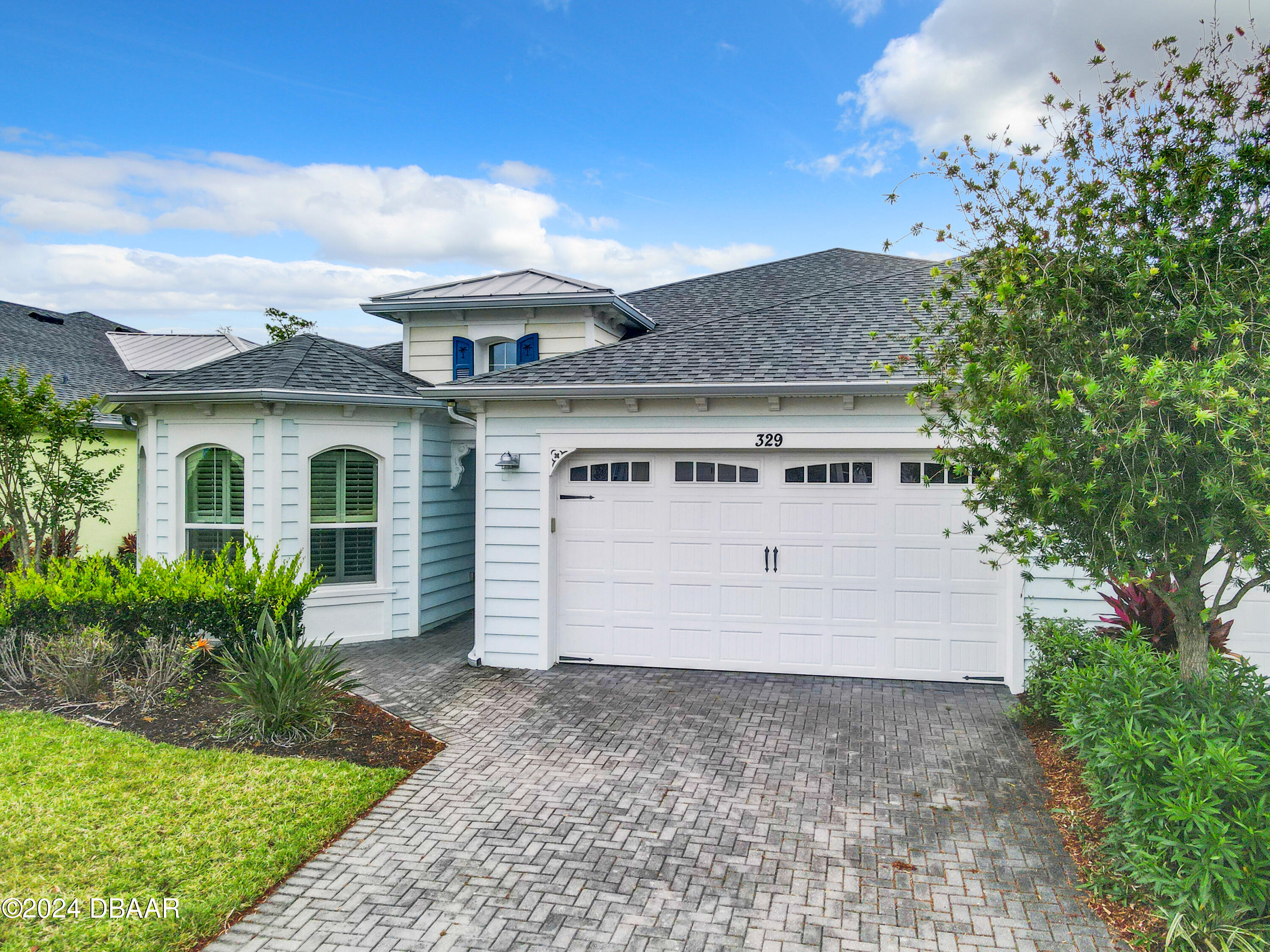 a view of front of house with a yard