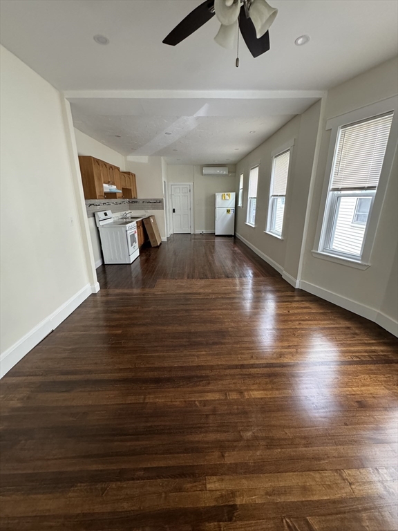 a view of livingroom and hardwood floor