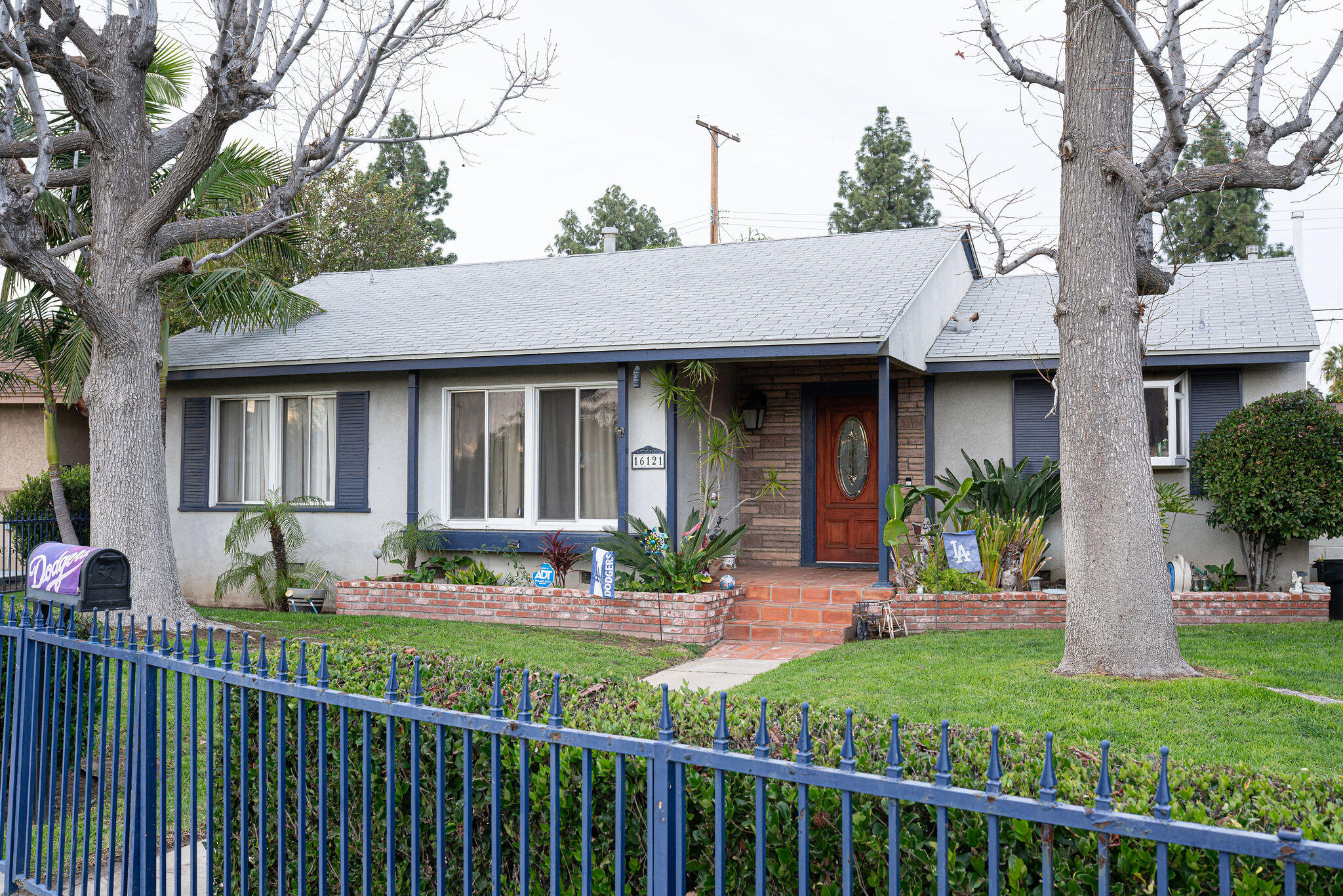 a front view of a house with a yard table and chairs