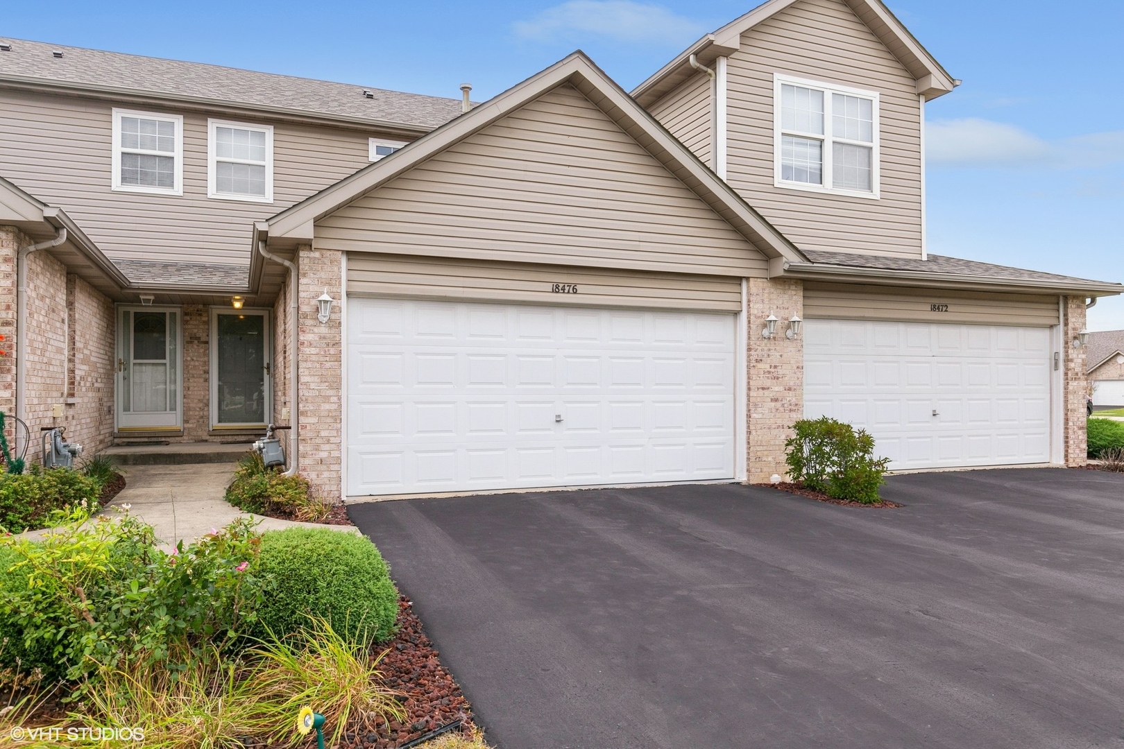 a front view of a house with a garage