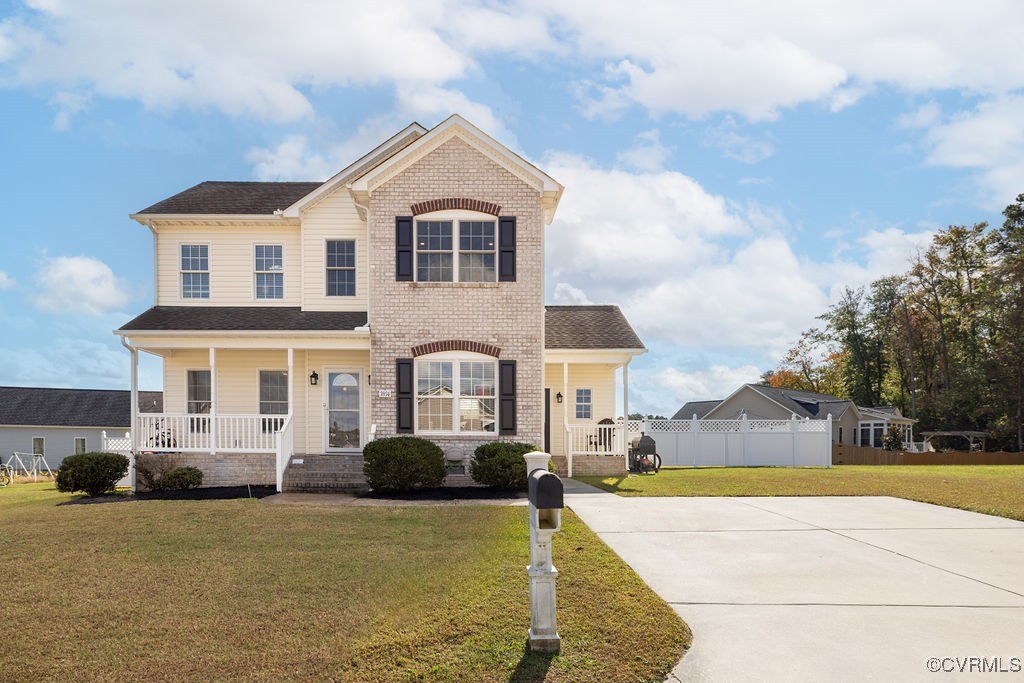 View of front of property featuring a porch and a