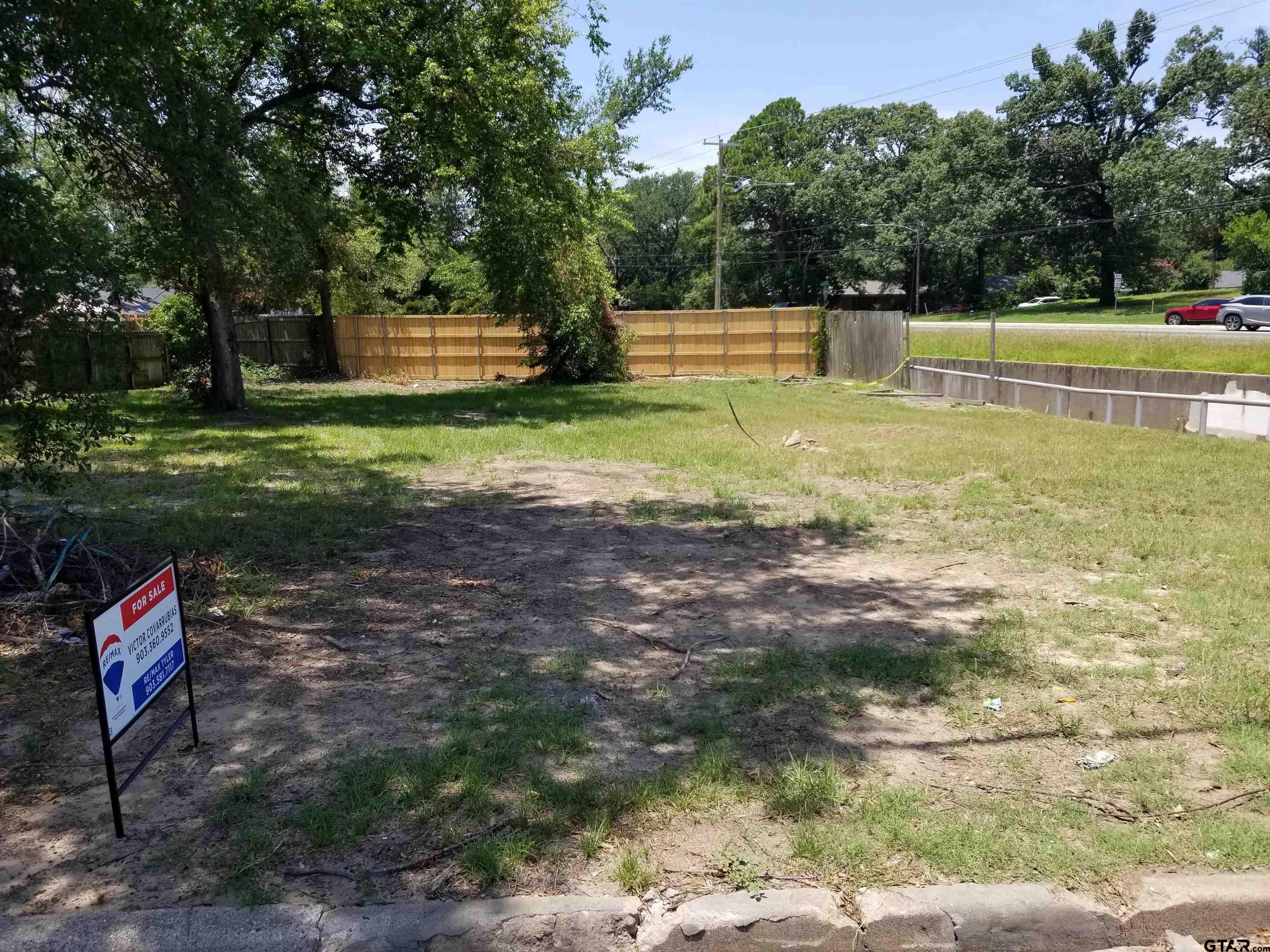 a view of a yard with a swimming pool