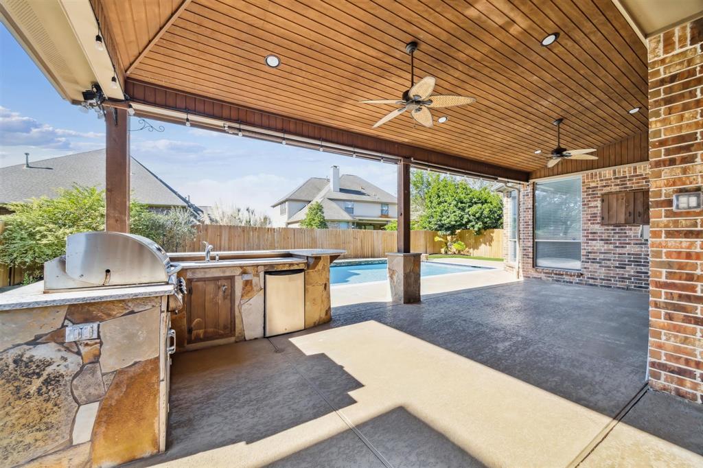 a view of a patio with a table and chairs