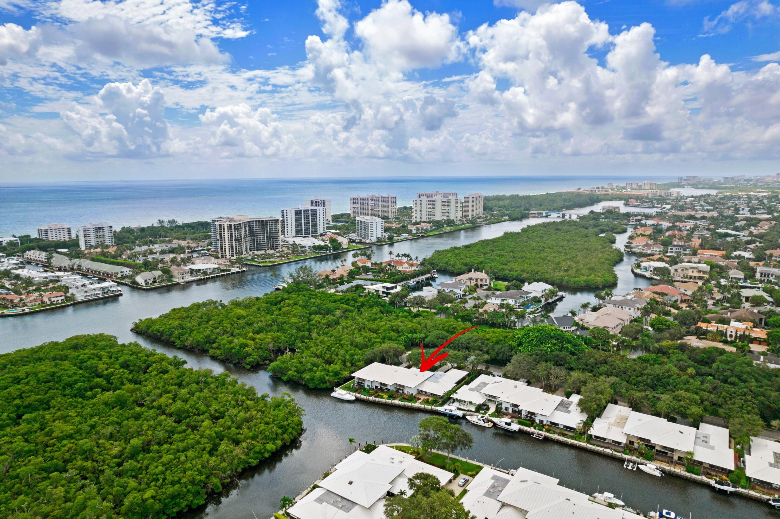 a view of a city with lots of lake and houses in the back