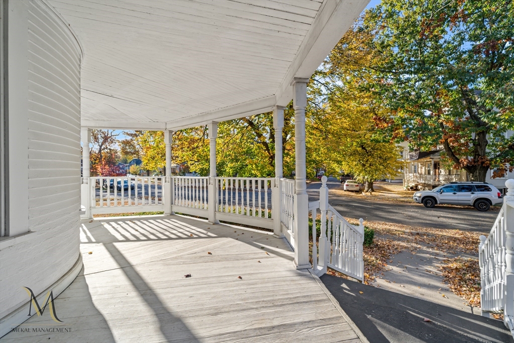 a balcony with view of a garden