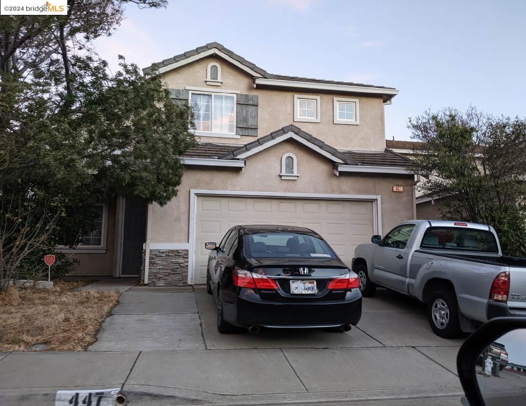 a view of a car parked in front of a house