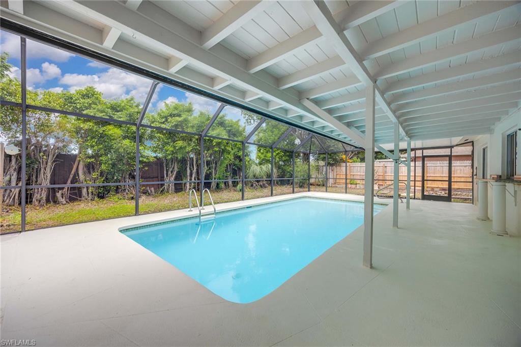 a view of a swimming pool with a porch