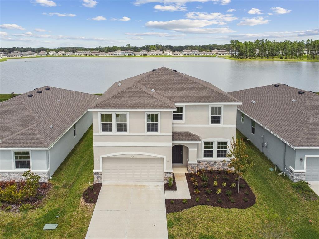 a aerial view of a house with a lake view