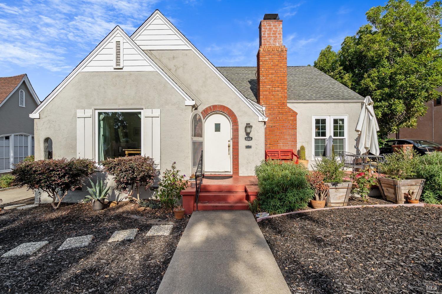 a front view of a house with garden