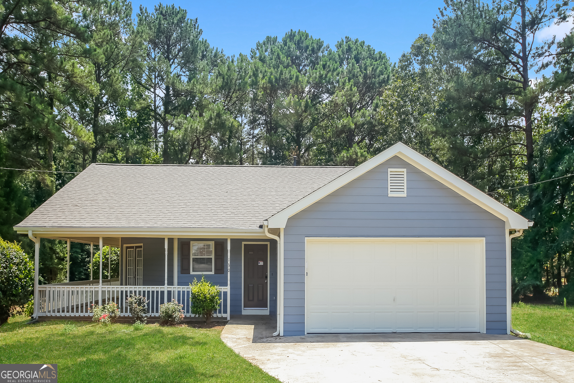 front view of a house with a yard