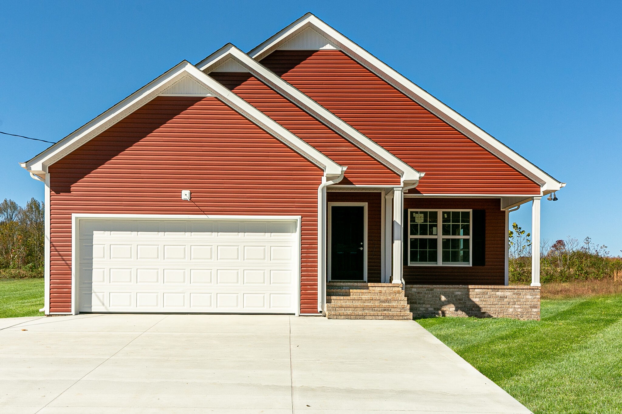 a view of house with yard