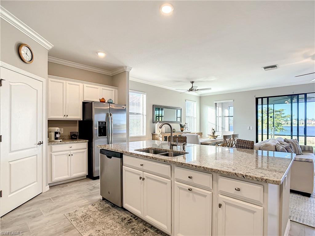 Kitchen full of natural light and lake views