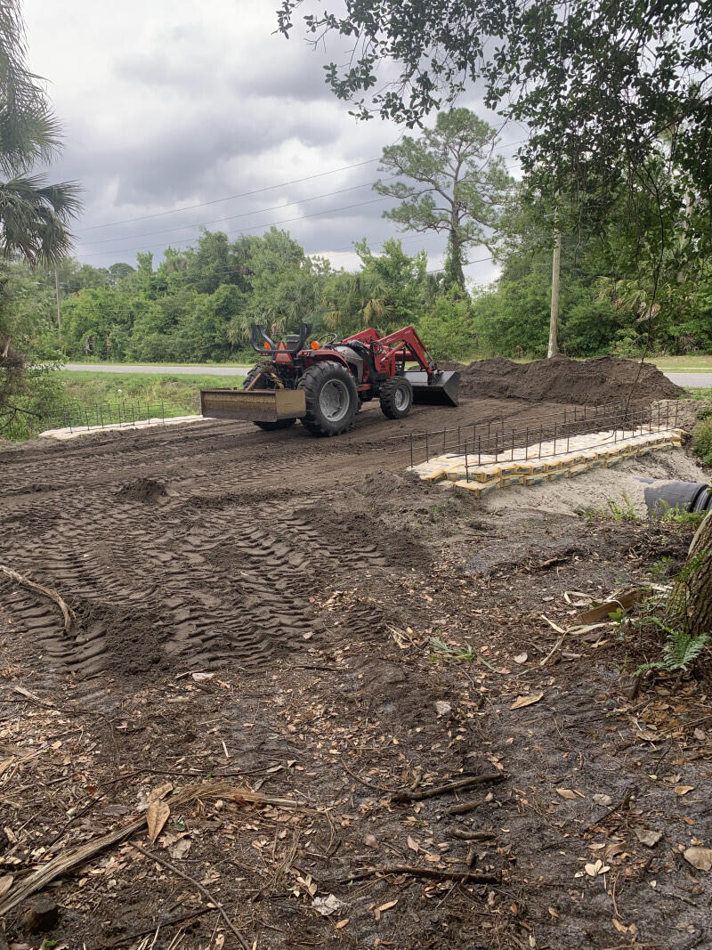 a view of yard with car parked