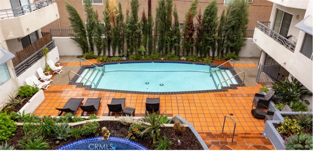 a view of a swimming pool with a patio