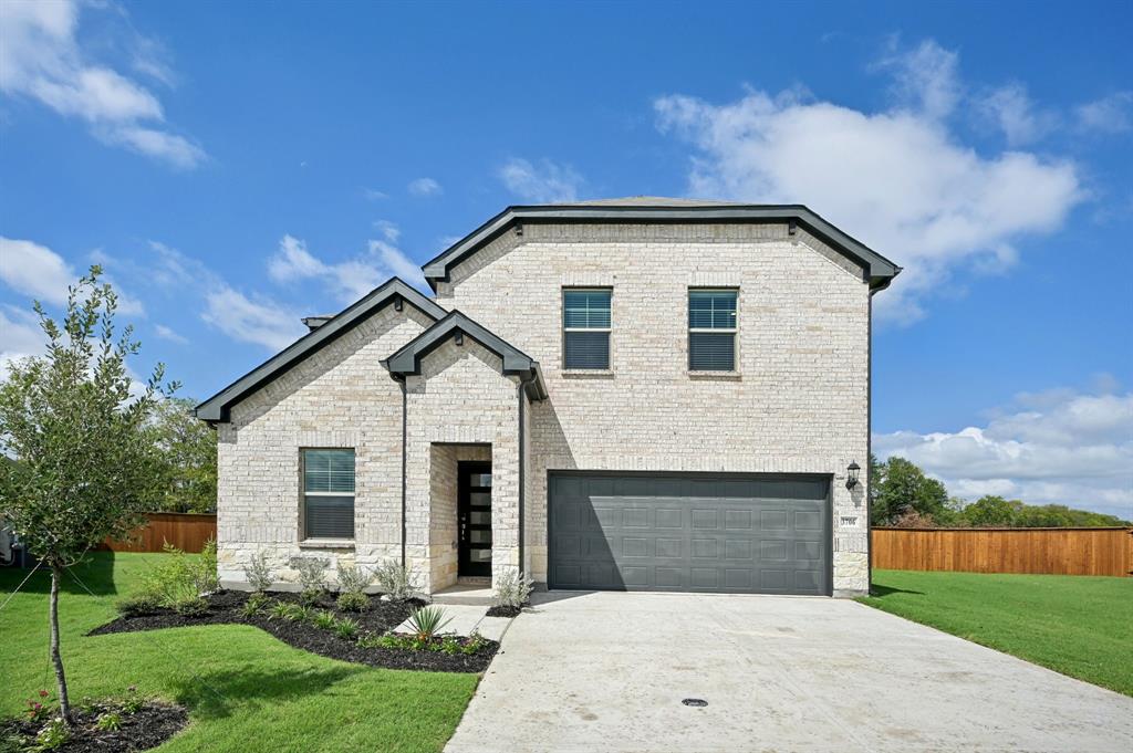 a front view of house with yard and green space