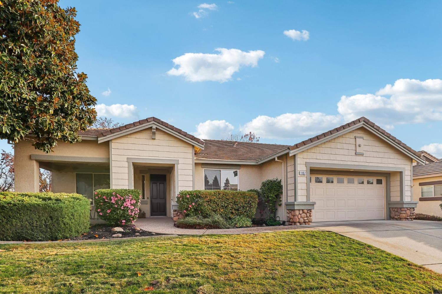 a front view of a house with a yard