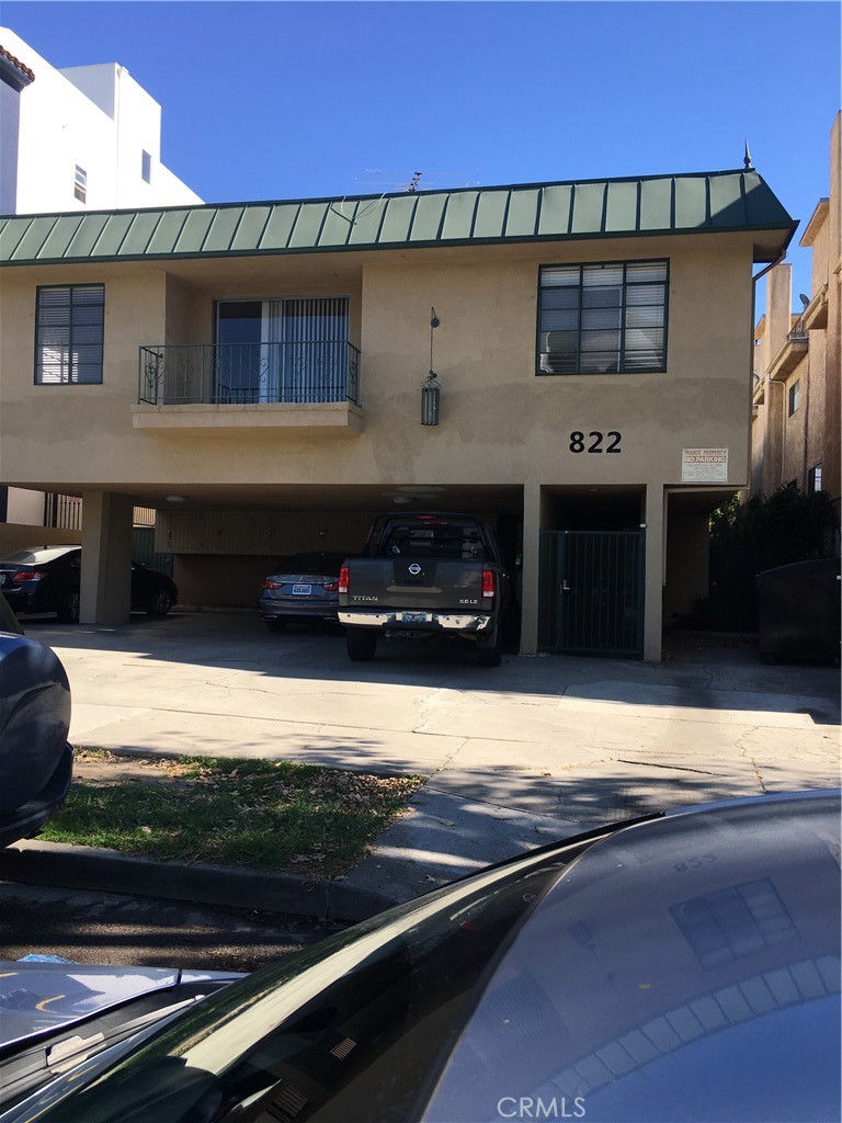 a view of a car park in front of the house