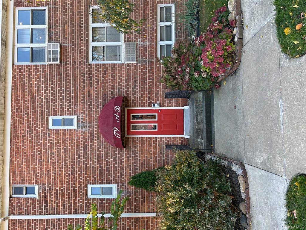 Entrance to property featuring cooling unit