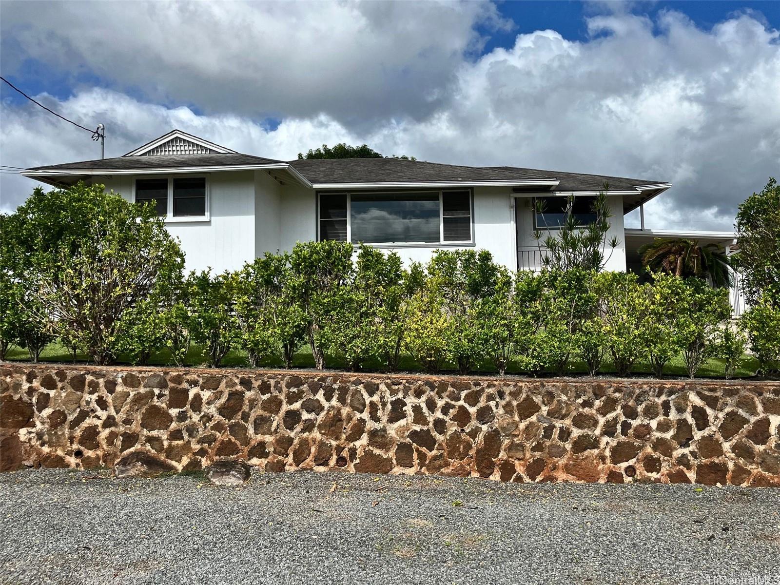 Retaining wall makes for a level front yard and additional street parking