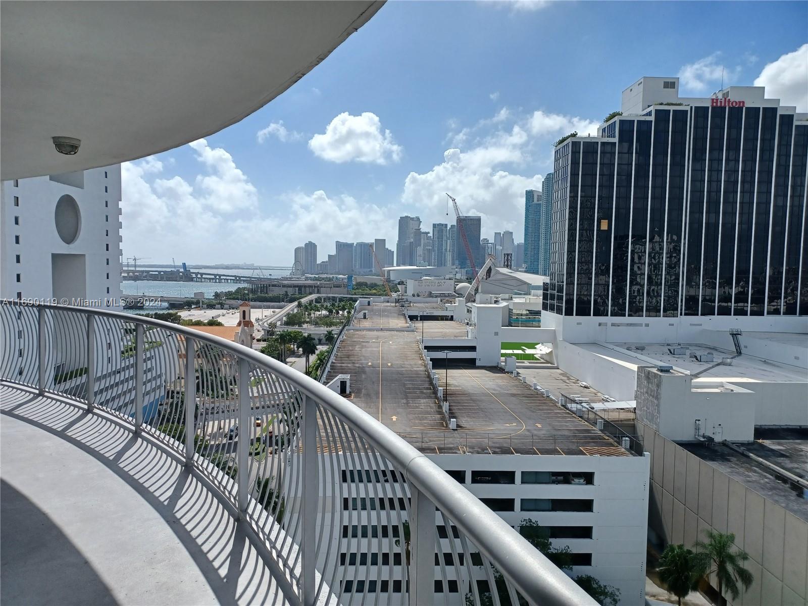 a view of a balcony with seating space