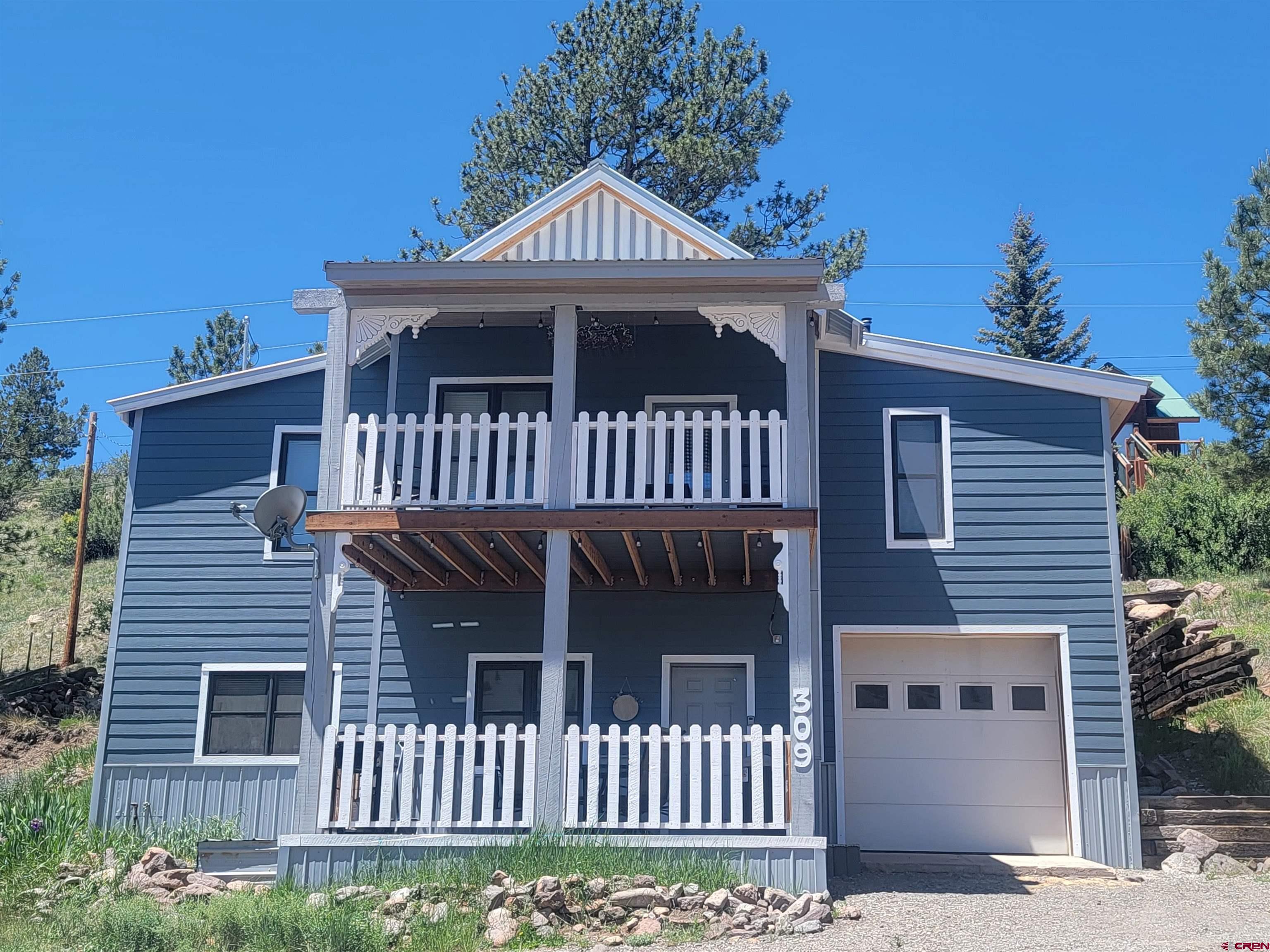 a front view of a house with a porch