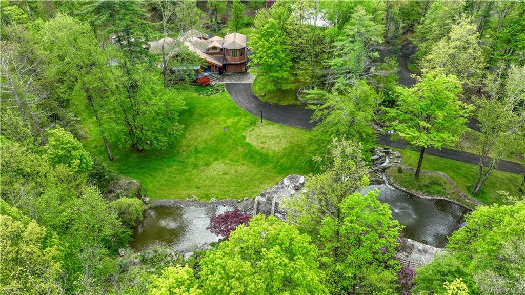 a backyard of a house with lots of green space