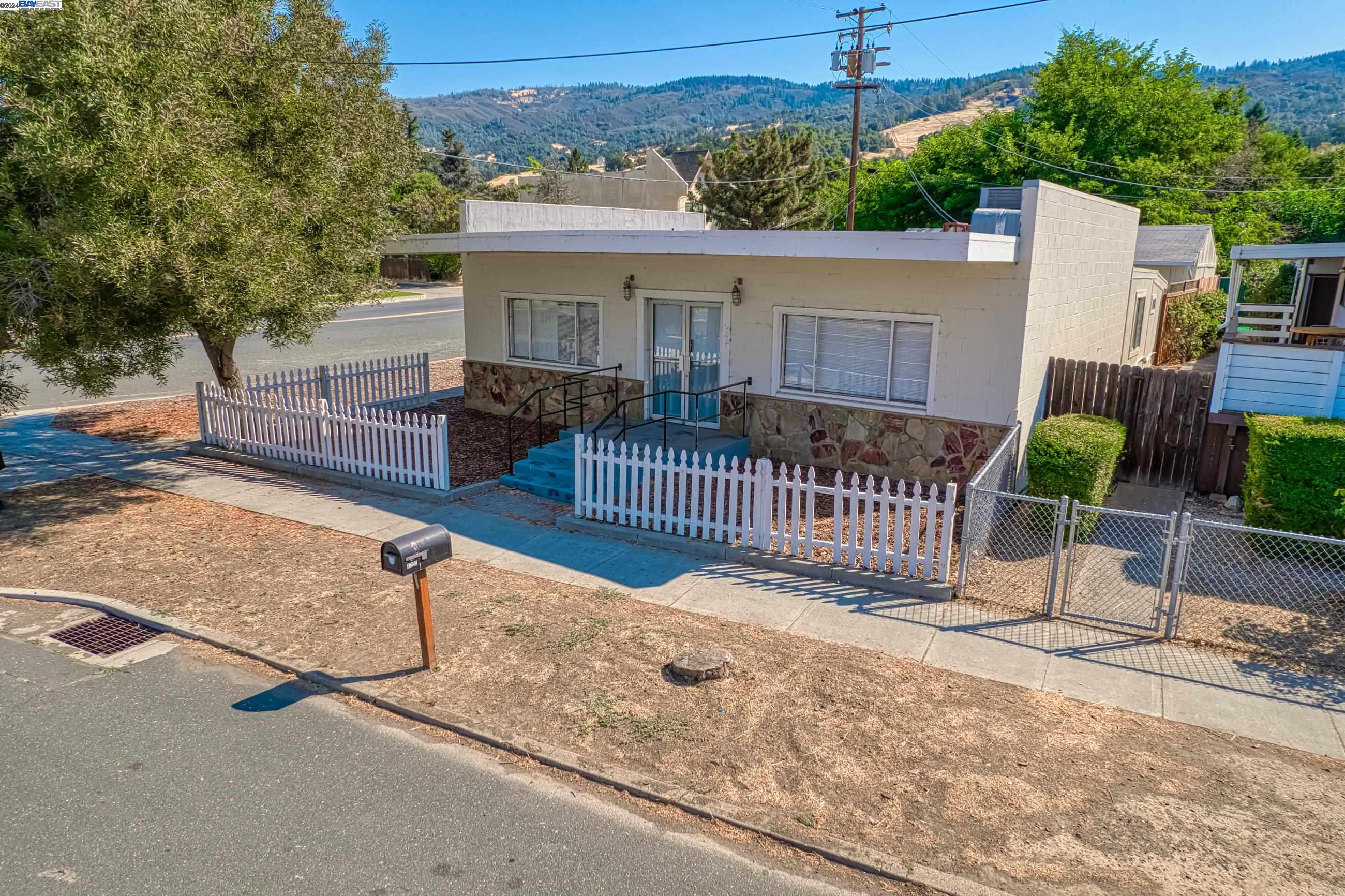 front view of a house with a bench