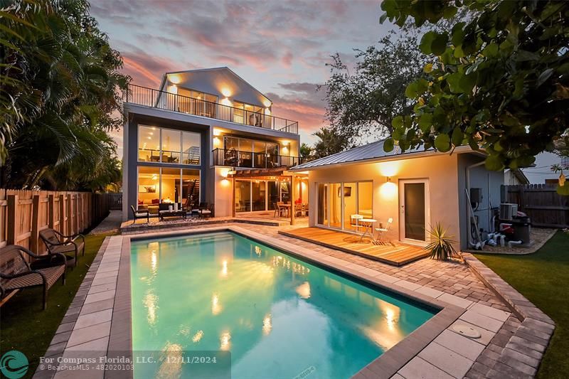 a view of a swimming pool with a lounge chairs