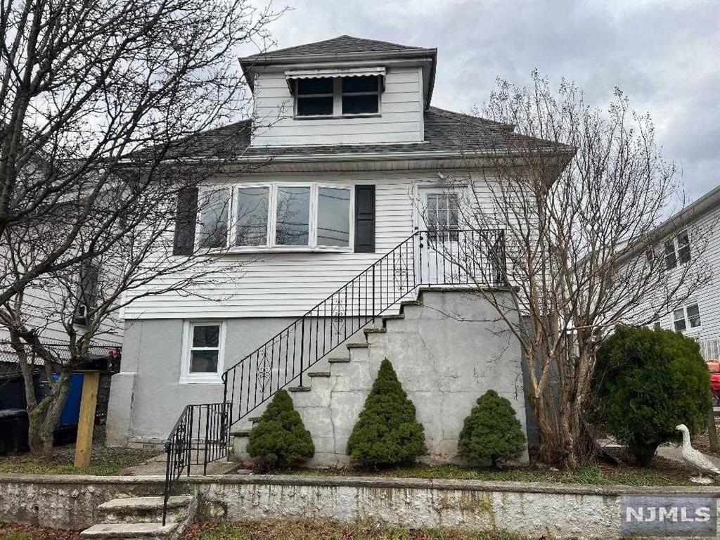 a front view of a house with garage