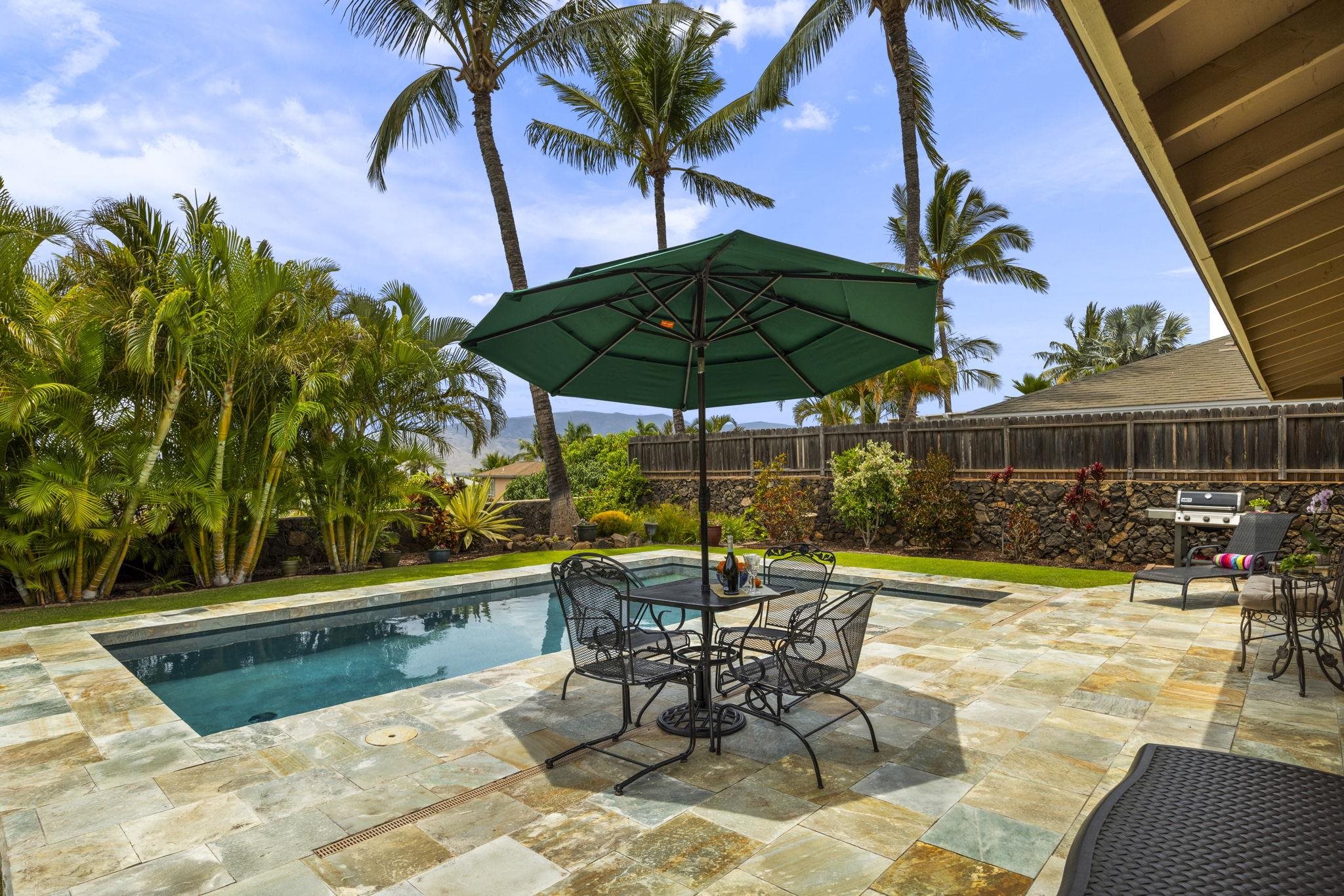 a view of backyard with outdoor seating and trees