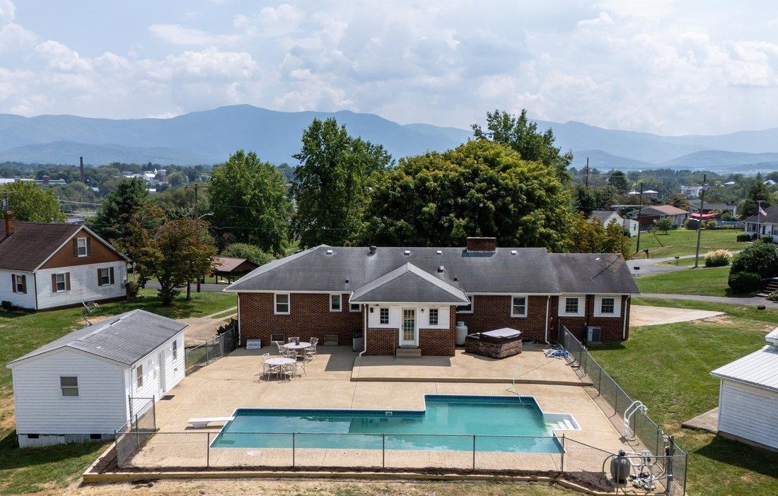 an aerial view of a house with a garden