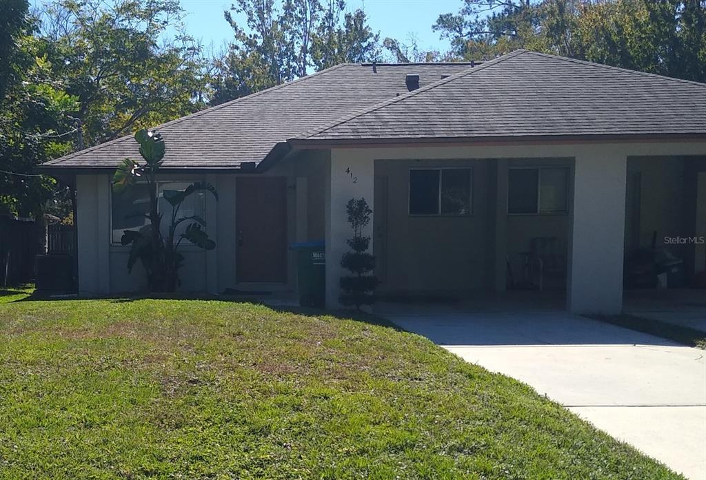 a house with trees in front of it